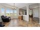Bright room featuring an adjacent sitting area, large windows, and an open floor plan, perfect for entertaining at 13753 Monroe St, Thornton, CO 80602