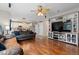 Spacious living room showcases hardwood floors, with a partial view of the adjacent kitchen at 13753 Monroe St, Thornton, CO 80602