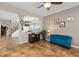 Inviting open-concept living space features tile floors, neutral walls, and an abundance of natural light at 13753 Monroe St, Thornton, CO 80602