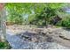 Serene backyard featuring rock features, mature trees and artistic landscaping, providing a tranquil outdoor space at 787 Eldorado Dr, Superior, CO 80027