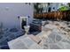Walk-out basement with stone steps and decorative urns at 787 Eldorado Dr, Superior, CO 80027