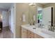 Bright bathroom featuring double vanity, towel racks, and decorative accents at 787 Eldorado Dr, Superior, CO 80027