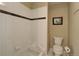 Bathroom featuring a tile surround tub and a toilet at 787 Eldorado Dr, Superior, CO 80027
