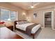 A sun-filled bedroom with neutral walls, fan, and walk-in closet for optimal storage at 787 Eldorado Dr, Superior, CO 80027