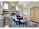 Elegant dining room with a fireplace, high ceilings, and large windows providing natural light at 787 Eldorado Dr, Superior, CO 80027