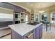Gourmet kitchen boasts stainless steel appliances, a cooktop island, and beautiful countertops at 787 Eldorado Dr, Superior, CO 80027