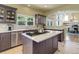 Stylish kitchen with a center island cooktop, stainless steel appliances, and light countertops at 787 Eldorado Dr, Superior, CO 80027
