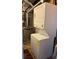 A functional laundry area featuring a stacked washer and dryer maximizing space efficiency at 787 Eldorado Dr, Superior, CO 80027