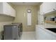 Functional laundry room with ample storage and modern washer and dryer at 787 Eldorado Dr, Superior, CO 80027
