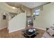 Open-concept living space with hardwood floors, high ceilings, and access to the dining area at 787 Eldorado Dr, Superior, CO 80027