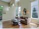 Bright living room features hardwood floors, high ceilings, and large windows for natural light at 787 Eldorado Dr, Superior, CO 80027