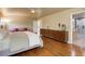 Spacious main bedroom with hardwood floors, ceiling fan, ensuite bathroom, and large closet at 787 Eldorado Dr, Superior, CO 80027