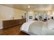 Serene main bedroom with a fireplace, hardwood floors, and large windows at 787 Eldorado Dr, Superior, CO 80027