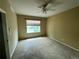 Spacious bedroom with ceiling fan and large window at 7482 W Saratoga Pl, Littleton, CO 80123