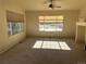 Living room with large windows, carpeting, and a view at 7482 W Saratoga Pl, Littleton, CO 80123