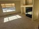 Living room features a fireplace and large windows offering abundant natural light at 7482 W Saratoga Pl, Littleton, CO 80123