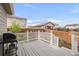 A view of the back deck with white railings, perfect for grilling and outdoor dining at 481 Vista Blvd, Brighton, CO 80603