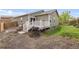 Backyard featuring a deck, patio, and green grass, perfect for outdoor enjoyment at 481 Vista Blvd, Brighton, CO 80603