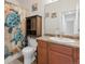 Bathroom featuring a turtle-themed shower curtain and wood vanity at 481 Vista Blvd, Brighton, CO 80603