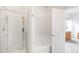 Bathroom features a shower and tub combination and a door to the bedroom at 481 Vista Blvd, Brighton, CO 80603