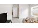 Serene bedroom with a large bed, neutral tones, and ample natural light from the window at 481 Vista Blvd, Brighton, CO 80603