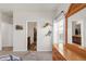 Bedroom with wood dresser and a partial view of the en-suite bathroom at 481 Vista Blvd, Brighton, CO 80603