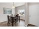Inviting dining area with natural light, table with seating, and stylish tile flooring at 481 Vista Blvd, Brighton, CO 80603