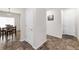 Hallway with tile floors, a storage closet and views of the dining area at 481 Vista Blvd, Brighton, CO 80603
