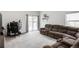 Spacious living room with a sliding glass door and plenty of natural light at 481 Vista Blvd, Brighton, CO 80603