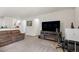 Living room with adjacent entertainment area and a view of the kitchen at 481 Vista Blvd, Brighton, CO 80603
