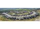 An aerial view of a well-planned community with neatly arranged homes and scenic surroundings in a serene setting at 3929 Treadway Pt, Castle Rock, CO 80108