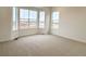 Bright and spacious bedroom with large windows offering neighborhood views at 3929 Treadway Pt, Castle Rock, CO 80108
