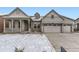 Charming home featuring stone accents, a covered porch, and a convenient two-car garage at 3929 Treadway Pt, Castle Rock, CO 80108