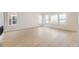 Bright living room with large windows and stylish hardwood floors at 3929 Treadway Pt, Castle Rock, CO 80108