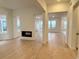 Bright, open concept living area with hardwood flooring and contemporary fireplace at 3929 Treadway Pt, Castle Rock, CO 80108