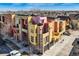 Aerial shot featuring colorful, modern townhouses and well-kept streets at 801 Confidence Dr # 9, Longmont, CO 80504
