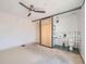 Bright bathroom featuring sliding door, toilet, and sink at 801 Confidence Dr # 9, Longmont, CO 80504
