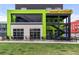 Stylish modern coffeehouse with outdoor seating, complemented by sleek architectural design and landscaping at 801 Confidence Dr # 9, Longmont, CO 80504