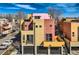 Modern, multi-story home showcasing a unique color block design and a sleek, contemporary aesthetic at 801 Confidence Dr # 9, Longmont, CO 80504
