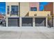 Street view of garages, sidewalk and second story home at 801 Confidence Dr # 9, Longmont, CO 80504
