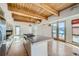 Contemporary kitchen with a large island, stainless appliances, and wooden cabinets at 801 Confidence Dr # 9, Longmont, CO 80504