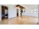 Open-concept living room featuring exposed wood beams and laundry closet at 801 Confidence Dr # 9, Longmont, CO 80504