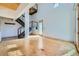 Inviting living room with a striking staircase, modern railing, and plenty of natural light at 801 Confidence Dr # 9, Longmont, CO 80504