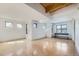 Bright living room with exposed wood beam ceiling and multiple windows at 801 Confidence Dr # 9, Longmont, CO 80504