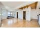 Open-concept living room featuring exposed wood beams and seamless transition to bathroom at 801 Confidence Dr # 9, Longmont, CO 80504