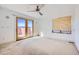Bedroom featuring a ceiling fan and sliding doors to the outside at 801 Confidence Dr # 9, Longmont, CO 80504