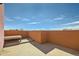Warm-toned patio with wooden bench, perfect for outdoor seating at 801 Confidence Dr # 9, Longmont, CO 80504