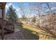 Landscaped backyard with grassy lawn and stepping down to a gravel patio at 3966 Aspen Hollow Ct, Castle Rock, CO 80104