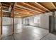 Unfinished basement with exposed beams and natural light at 3966 Aspen Hollow Ct, Castle Rock, CO 80104