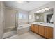 This bathroom offers double sinks, a soaking tub, and a separate glass enclosed shower at 3966 Aspen Hollow Ct, Castle Rock, CO 80104